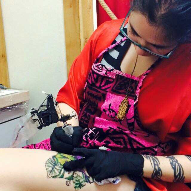 Sori doing her one of her apprentice tattoos